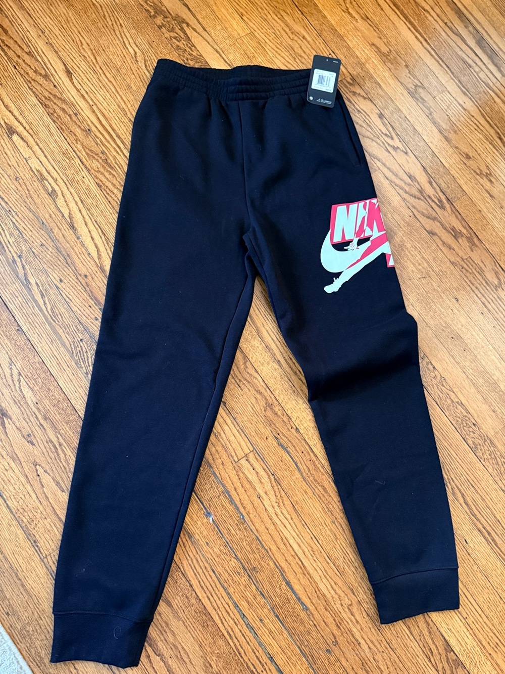 Boys' black Jordan fleece joggers in size XL,